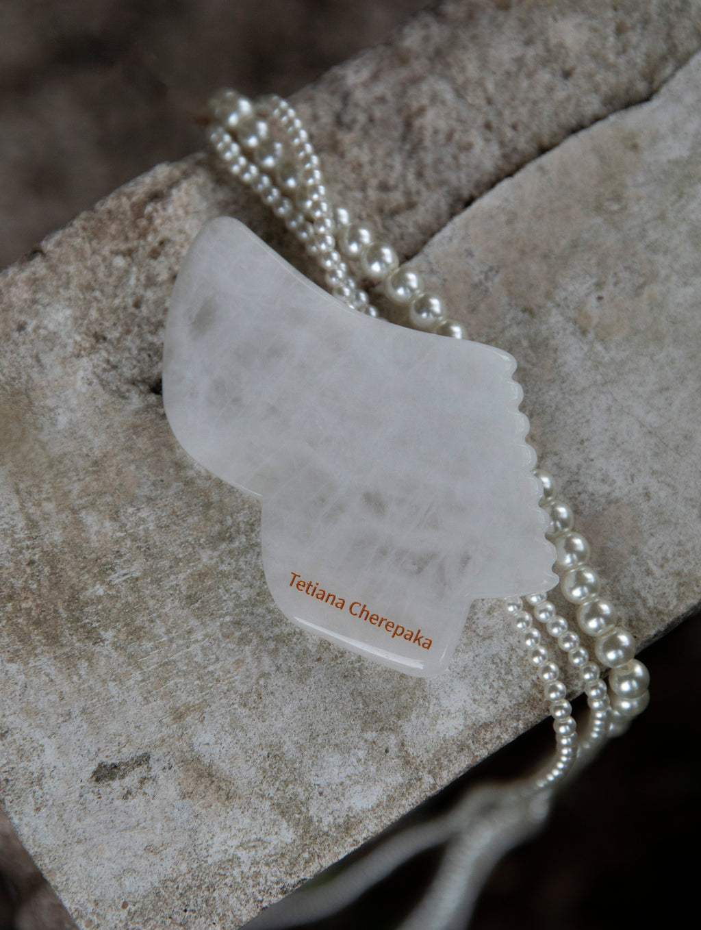 White jade gua sha by Tetiana Cherepaka