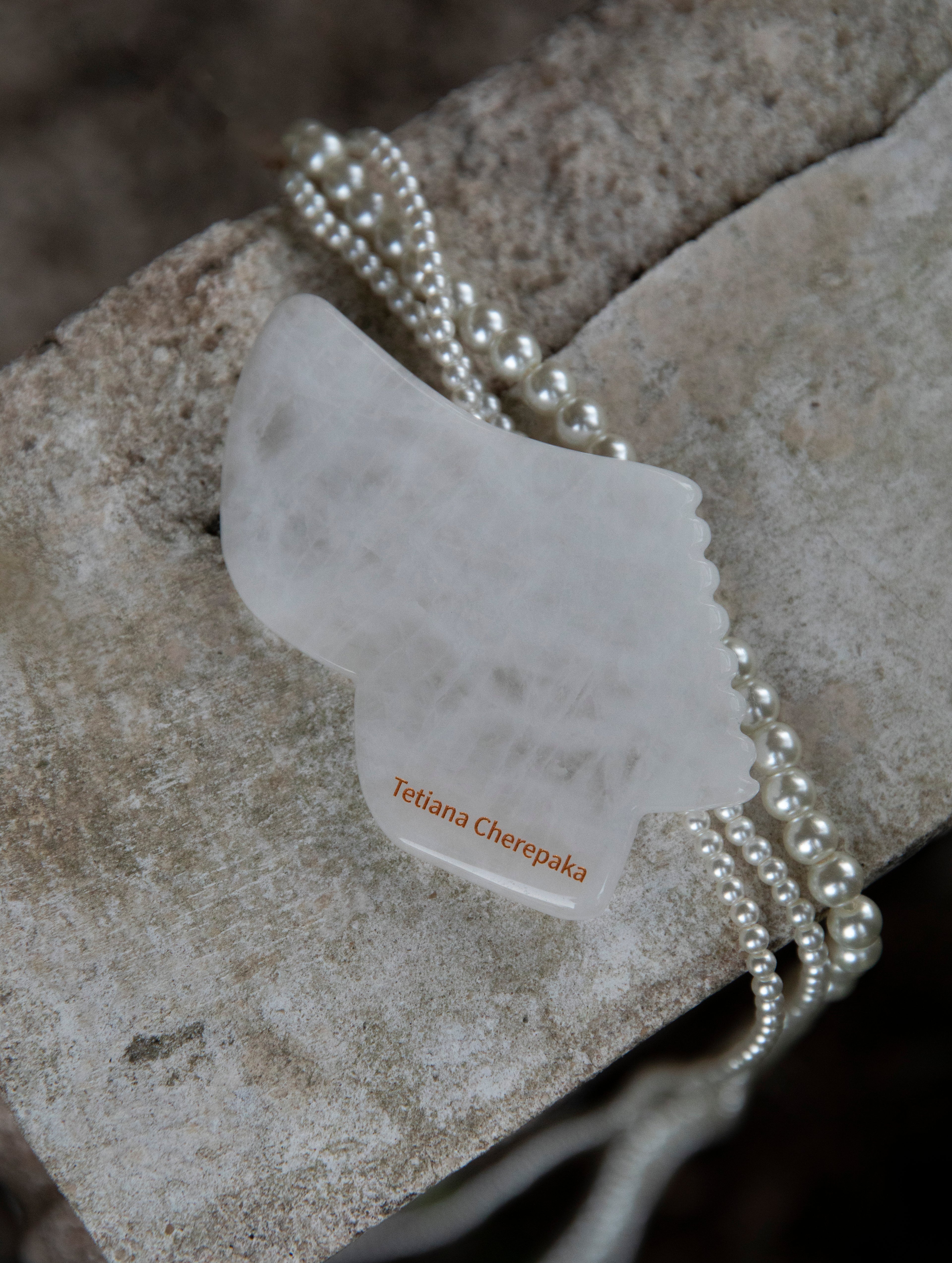 White jade gua sha by Tetiana Cherepaka